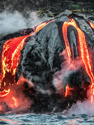 Hawaii lava flow entering the ocean on Big Island from Kilauea volcano